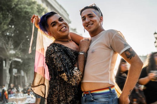Portrait of gay friends on LGBTQIA pride parade